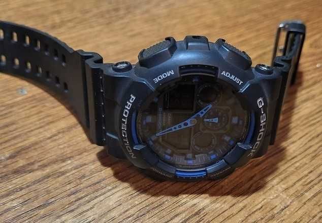 Casio G-Shock GA 100-1A2ER
Black/ Blue как новые