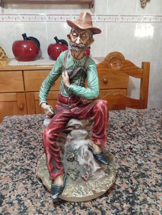 Estatueta de velho
