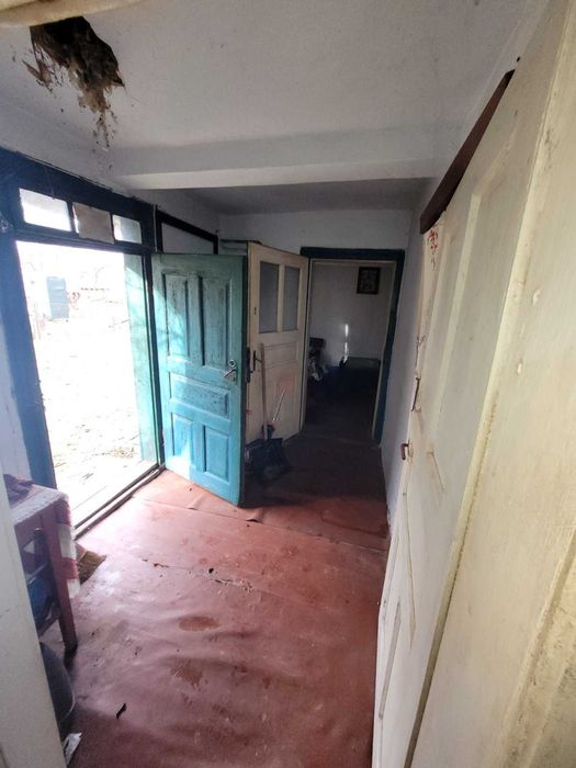 Дерев'яний будинок та земельна ділянка 14 сот. м. Кам'янка-Бузька