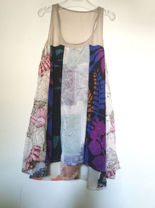 Jedwabna bluzka boho patchwork – rozmiar 4
Materiał:  jedwab

Zjawis