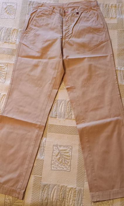 Calças cremes de homem da Lion of Porches