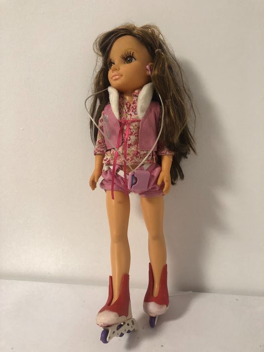 Nancy com bicicleta,com patins e esqui