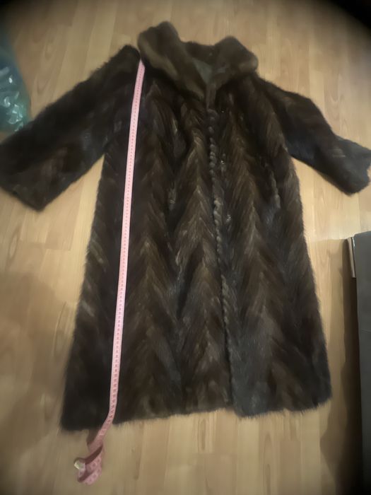 Норкова шуба шита полосами