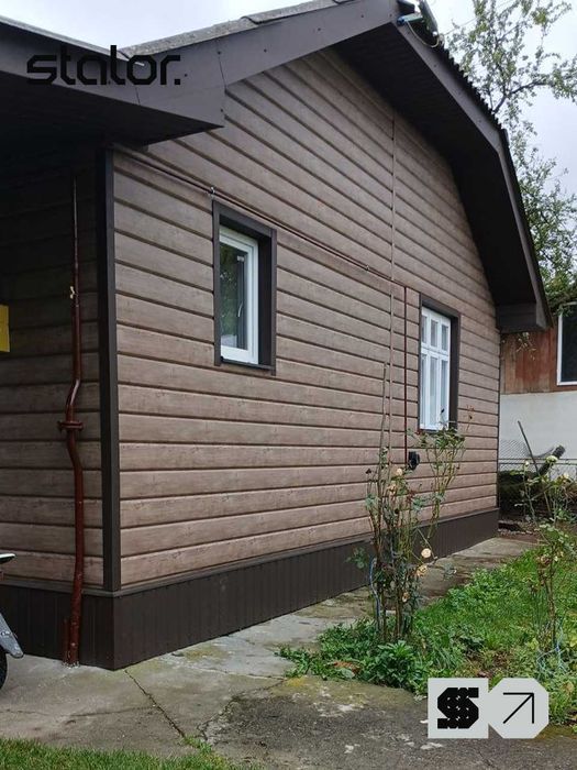 Металевий сайдинг під дерево. Фасадні панелі. Стрий