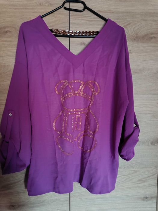 Nowa piękna bluzka z wywijanym rękawem