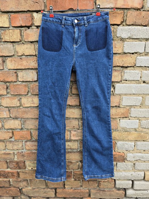 Damskie spodnie jeansowe jeansy dzwony TU
