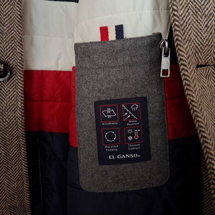 Casaco masculino espinhado, feito de lã com acabamento impermeável.