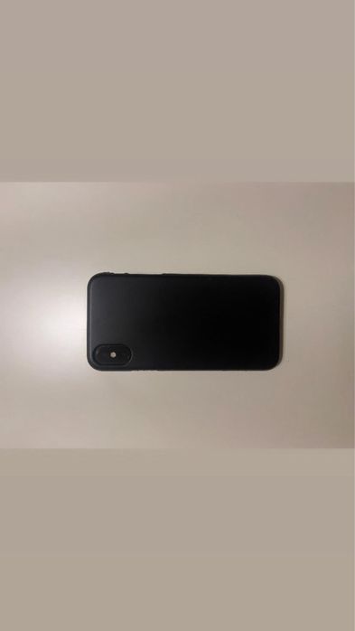 iPhone XS with case64740314133123124