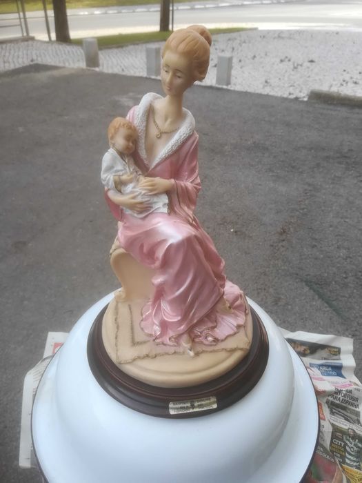 estatueta de marfinite mãe rica