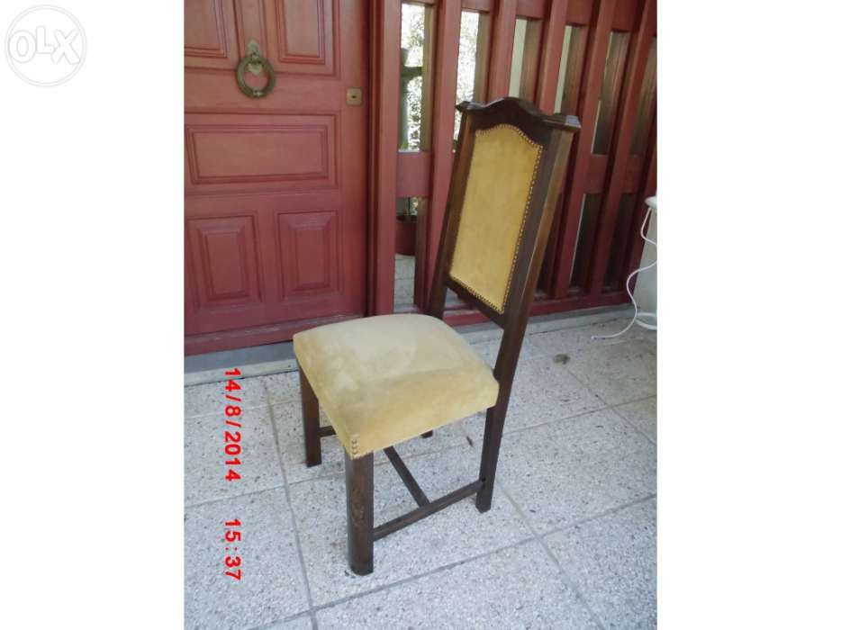 Brown wooden chair upholstered in cream-colored velvet