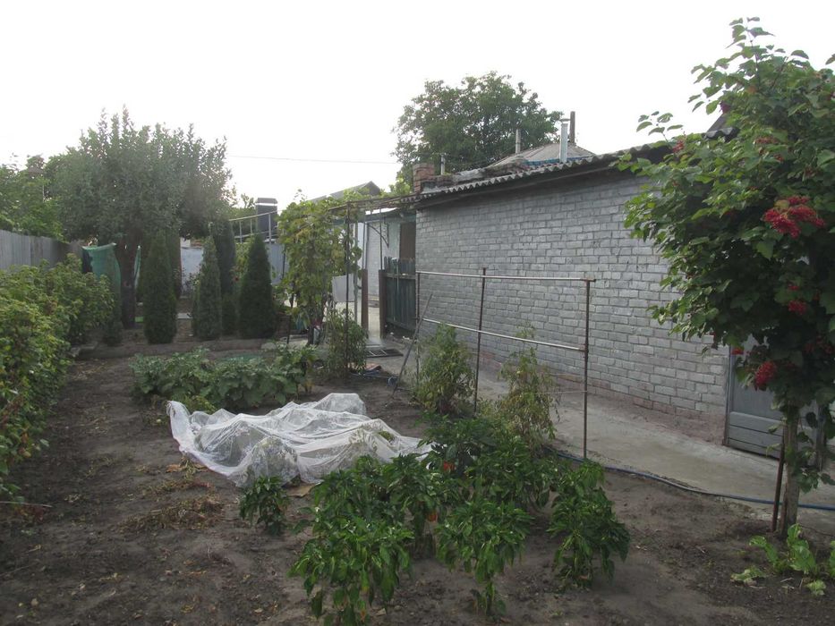 Продам  будинок по вул. В.Скринника (р-н пл.Покровської) або обміняю на 1-2 кімнатну квартиру