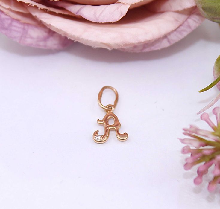 Złota zawieszka p.585/0,41g - literka "A" z cyrkonią