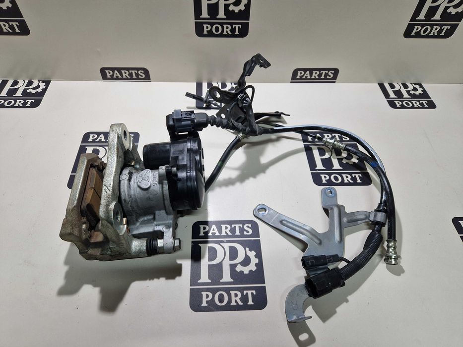 Суппорт в сборе задний правый Nissan Rogue 2021+ электро  D40006RA0C