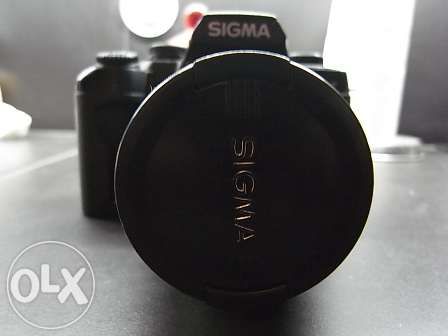 Máquina fotográfica Sigma SA7 reflex lente 28-70