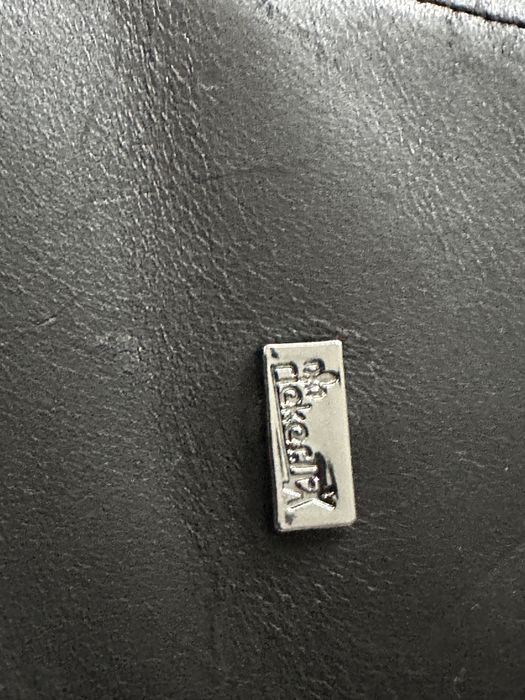 Damskie skorzane botki Rieker ocieplane owczą wełną.