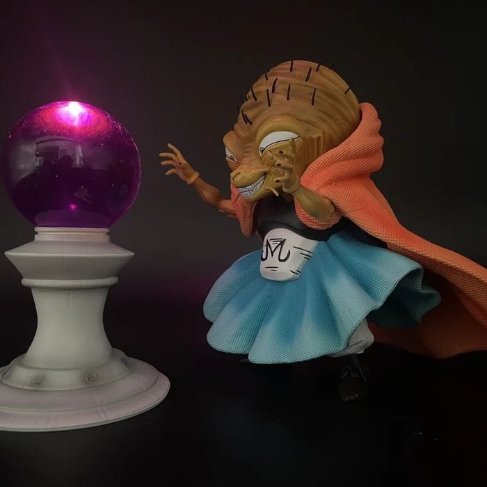 Figura dragon ball com bola de luz