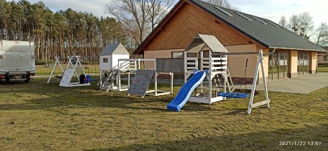 Plac zabaw huśtawka bocianie gniazdo stolik domek mostek transport