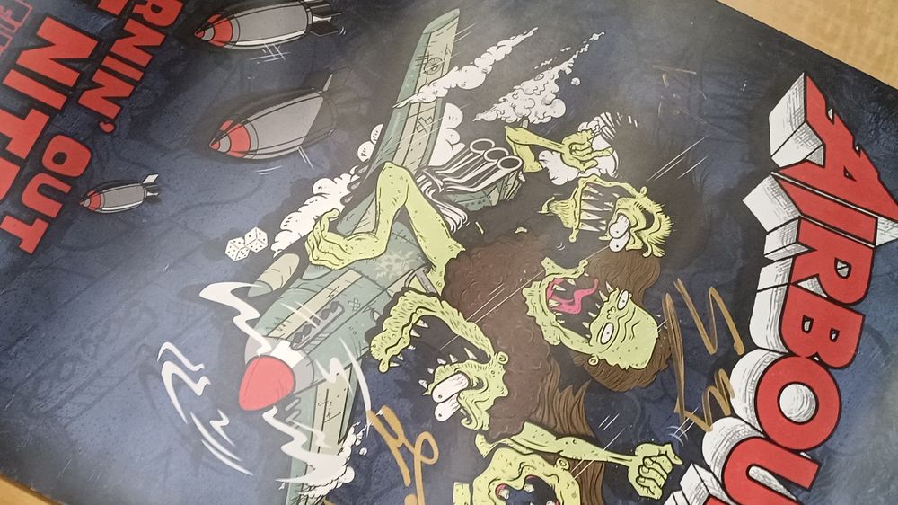 Plakat Airbourne z podpisami całego zespołu