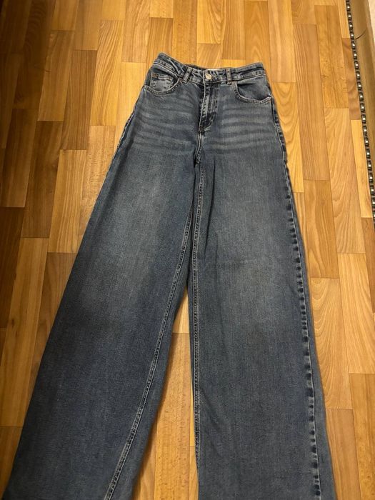 Джинси темно синього кольору