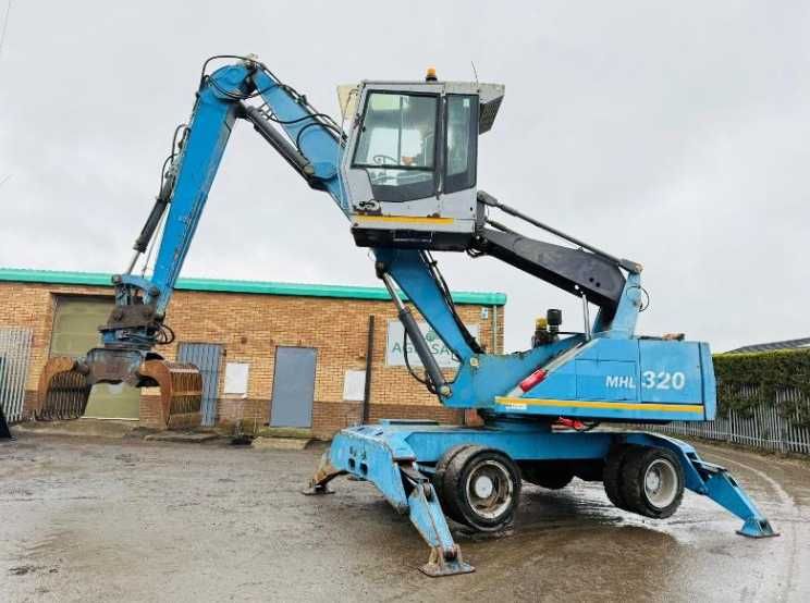 Екскаватор для перевалки лісу , металолома FUCHS MHL 320