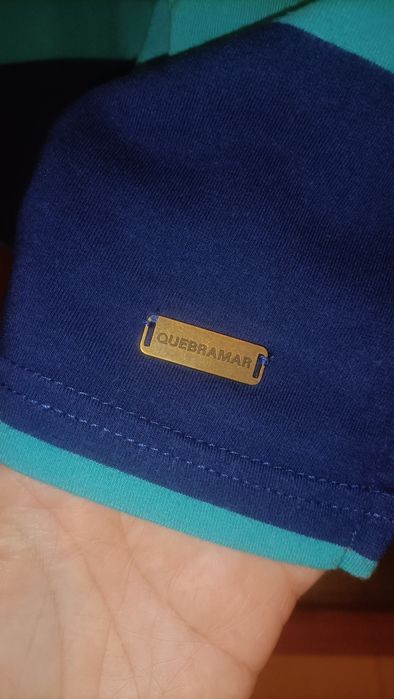 Polo Quebramar com fecho, apontamentos laranja