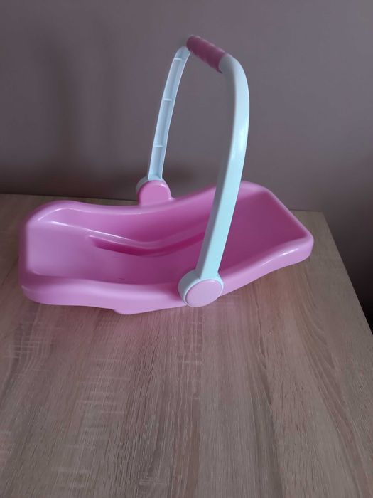 Lalka bobas, nosidełko i ubranka.