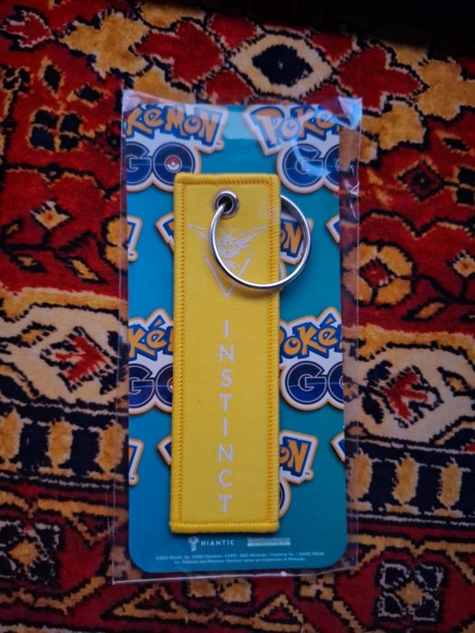 Pokémon GO Niantic Team Instinct żółty brelok – NOWY, oryginalny