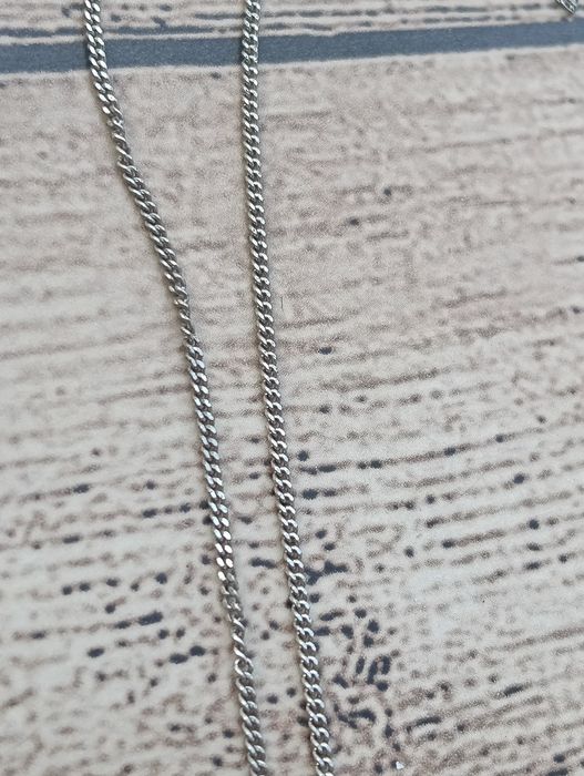 Fio de prata com pendente,tal como se encontra