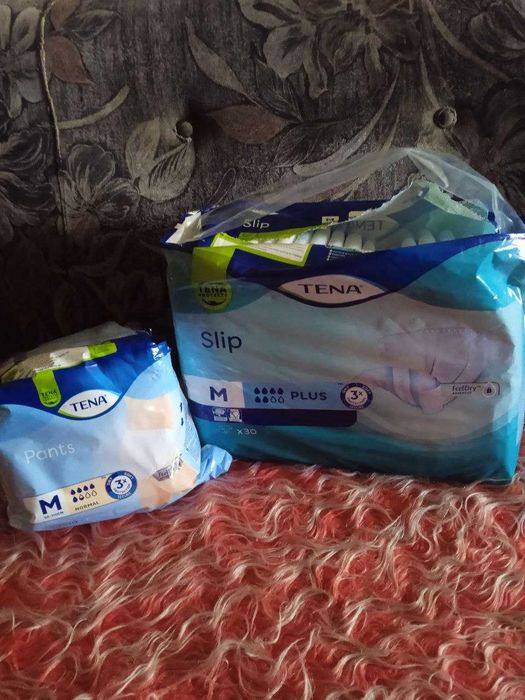 Одноразові пелюшки та підгузки  Tena