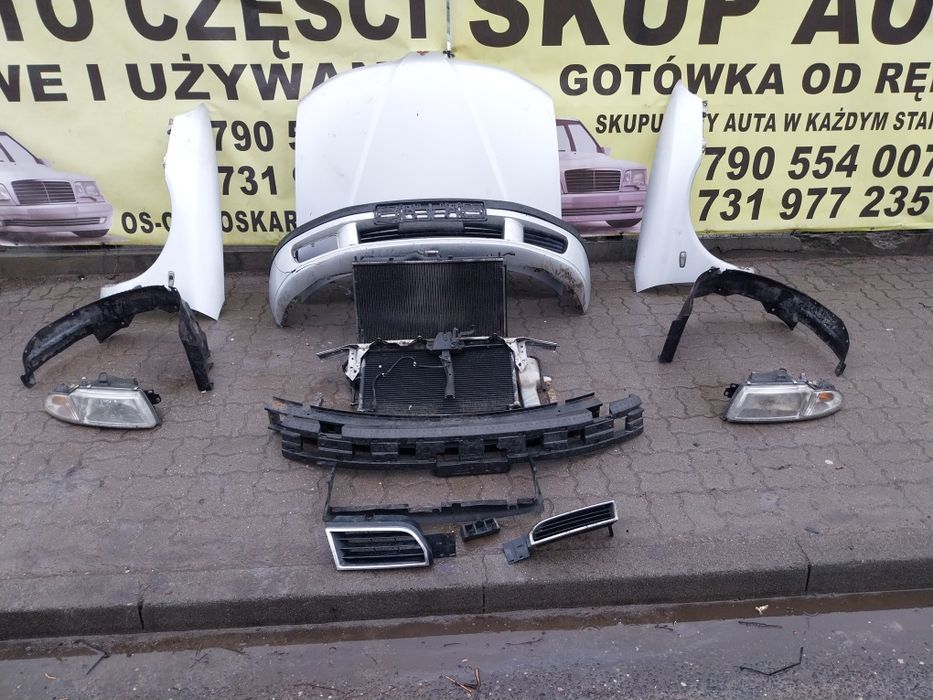 Mitsubishi Carisma zderzak  lampa chłodnice belka pas kpl