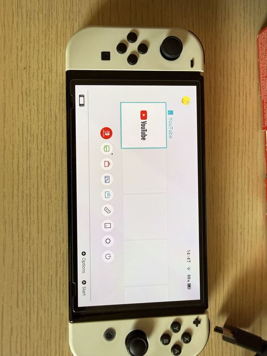 Nintendo Switch Oled, 2 gry, karta 256 GB, pokrowiec