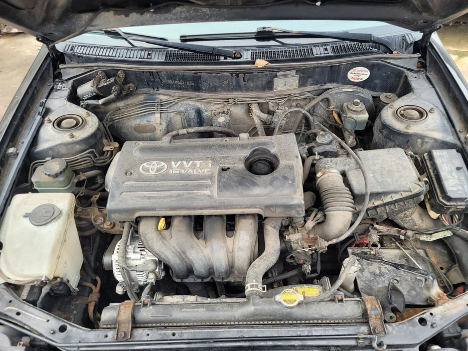 TOYOTA COROLLA E11 LIFT 1.6 VVTI silnik skrzynia napęd sanki belka wahacz wahacze zacisk zaciski zwrotnica piasta kopyto