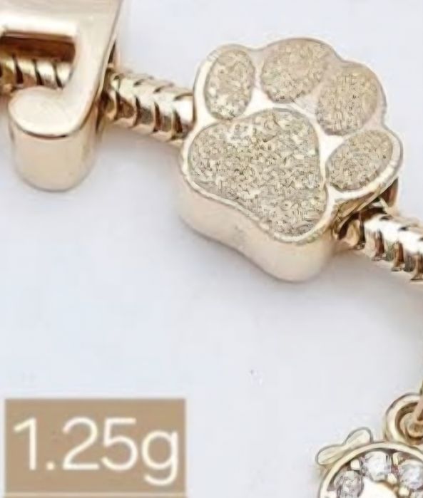Charms łapka złota