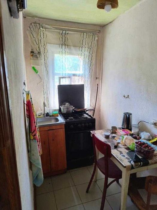 Продам 1/2 дома в центре Змиева