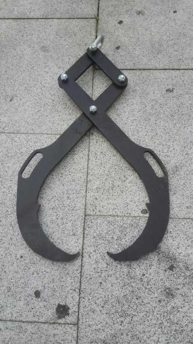 Pinça para rolos de madeira.