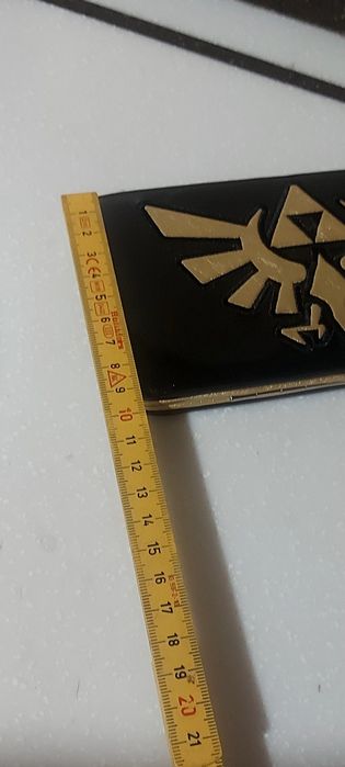 Кошелёк с золотистым изображением Королевского герба Хайрула