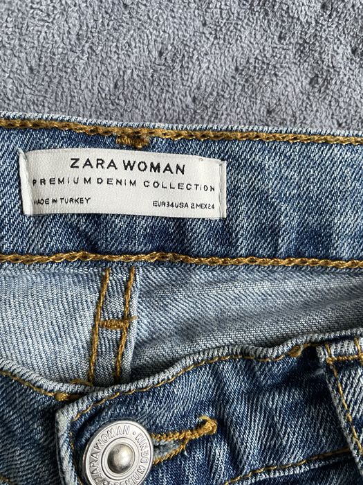 Spodnie jeansowe z dziurami, przetarciami Zara