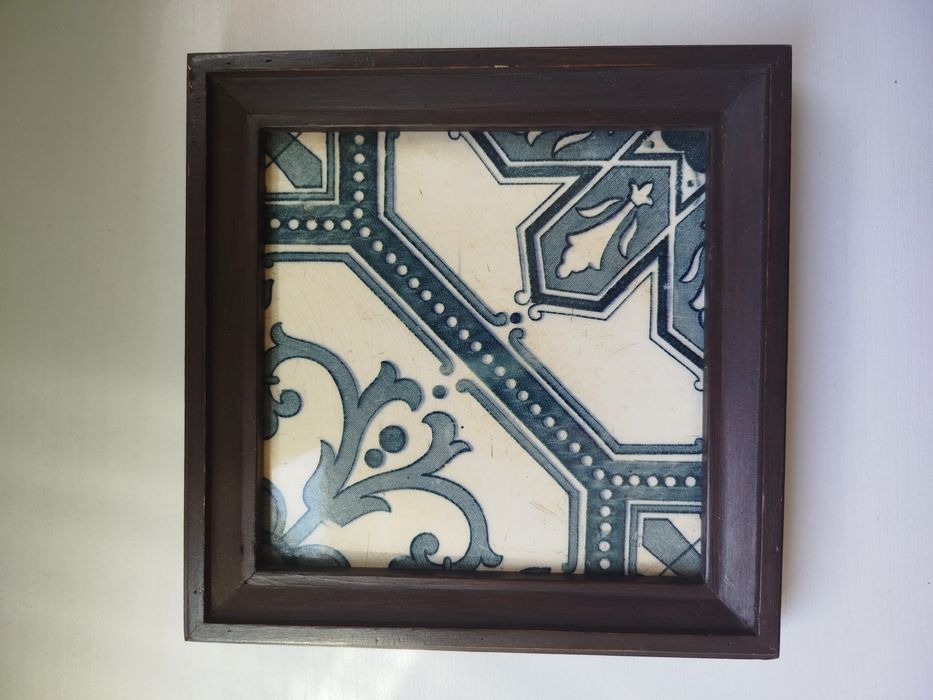 Ancient azulejo with wooden frame