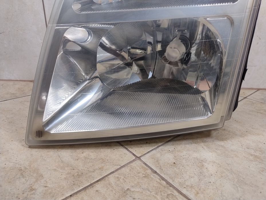 Ford connect tourneo lampa reflektor lewy przód Europa oryginał wysyłka Ford Transit Connect I (2002-2013)