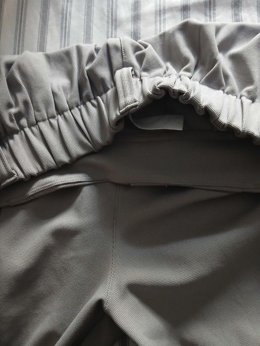 Calcas em polyester, tamanho L.