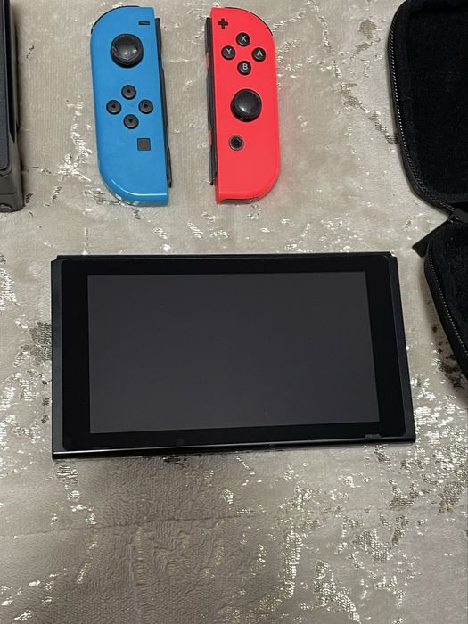 Nintendo Switch V2, 2 comando,2 jogos e bolsa de transporte