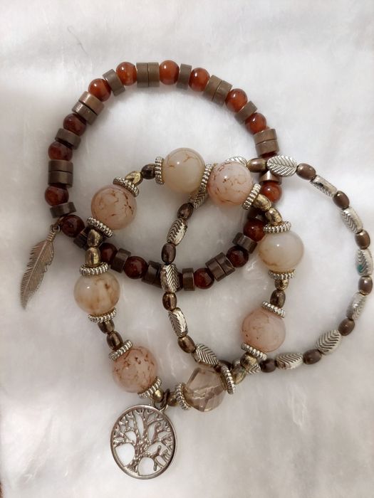 Pulseiras em prata, rodio e aço dourado