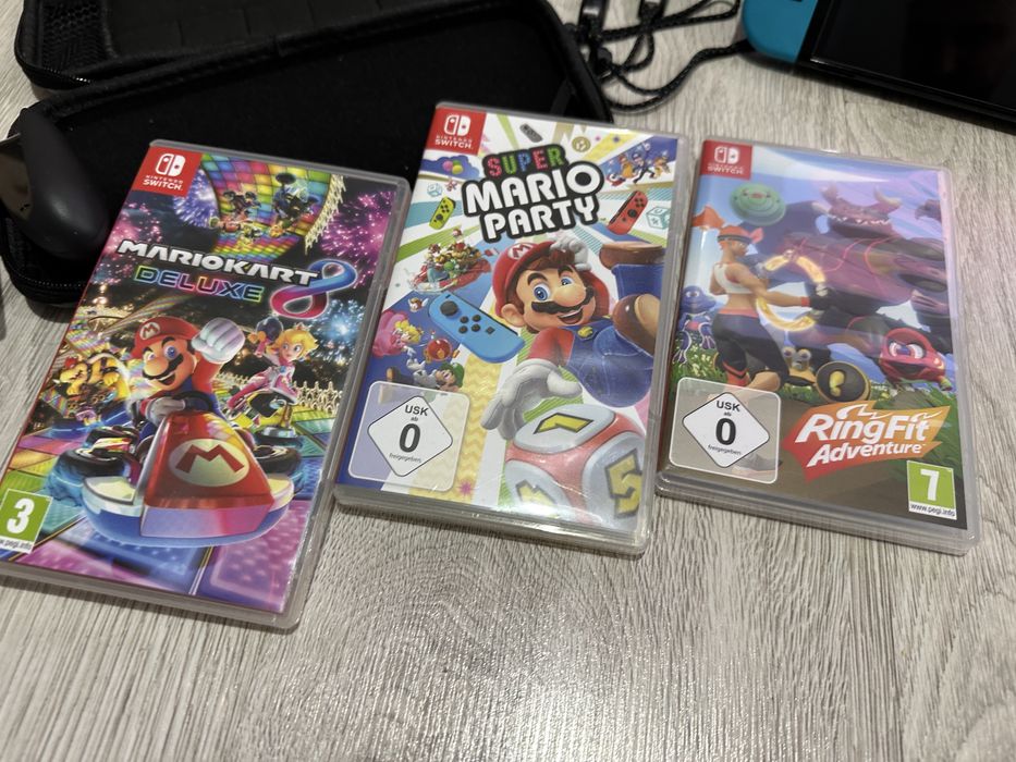 Nintendo Switch OLED + gry + Ring Fit Adventure + etui