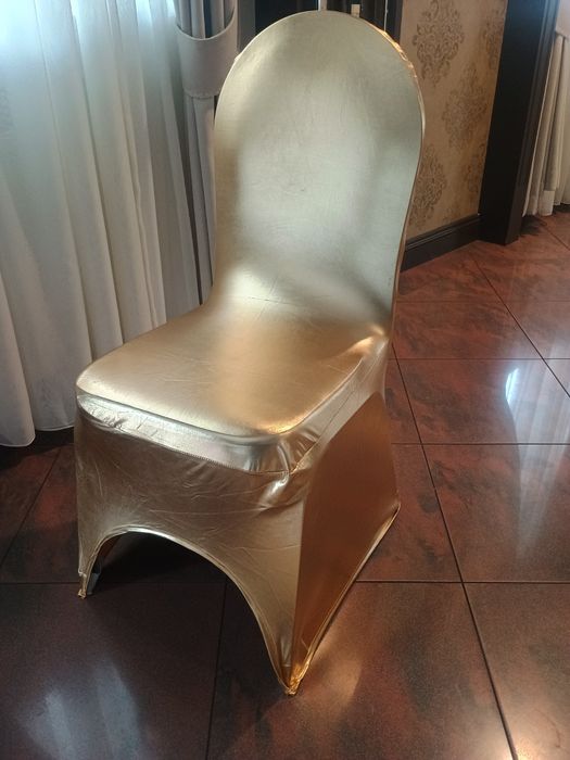Pokrowce  na krzesła bankietowe złote, czarne i białe .Wynajem W-wa