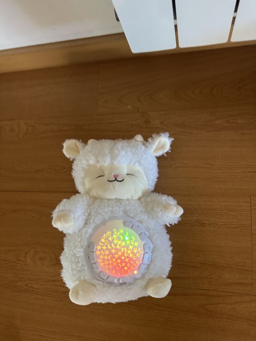 Peluche branco luminoso e com música