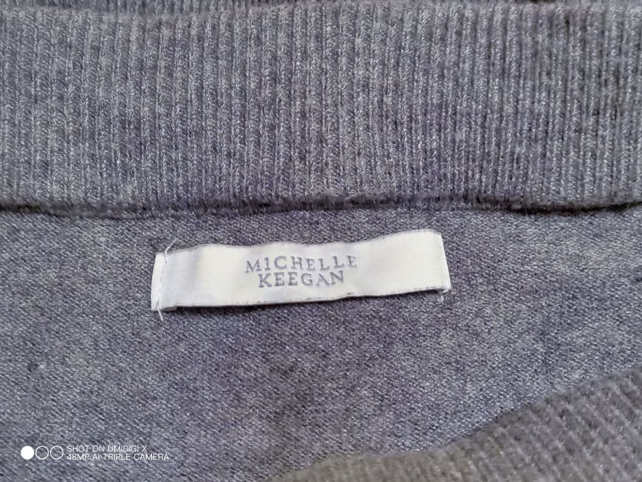 Sweter z falbaną