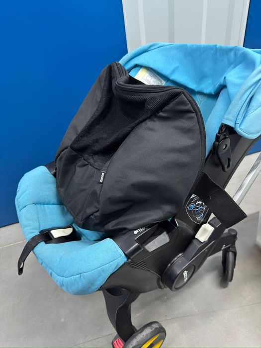 Doona+  Pack Completo: Base Isofix + Mala Oficial + Capa Chuva