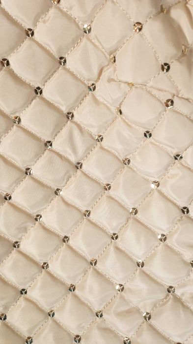 Casaco acolchoado beje com lantejoulas