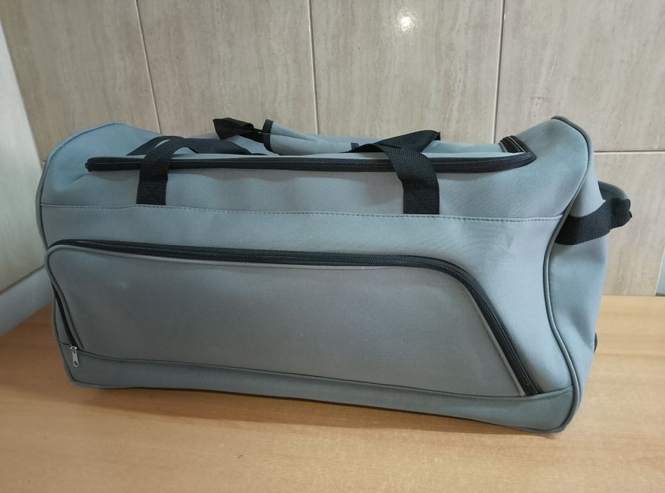 Duża torba podróżna na kółkach 70x35x35 cm 80L