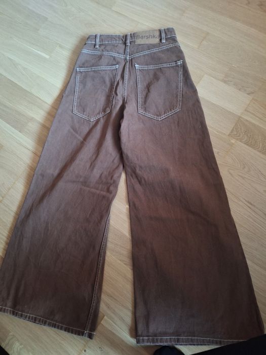 Damskie jeansy dzwony Bershka 32